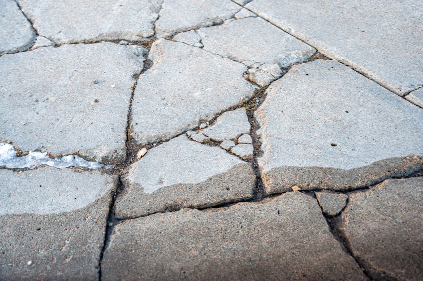 Cracked and residential concrete sidewalk